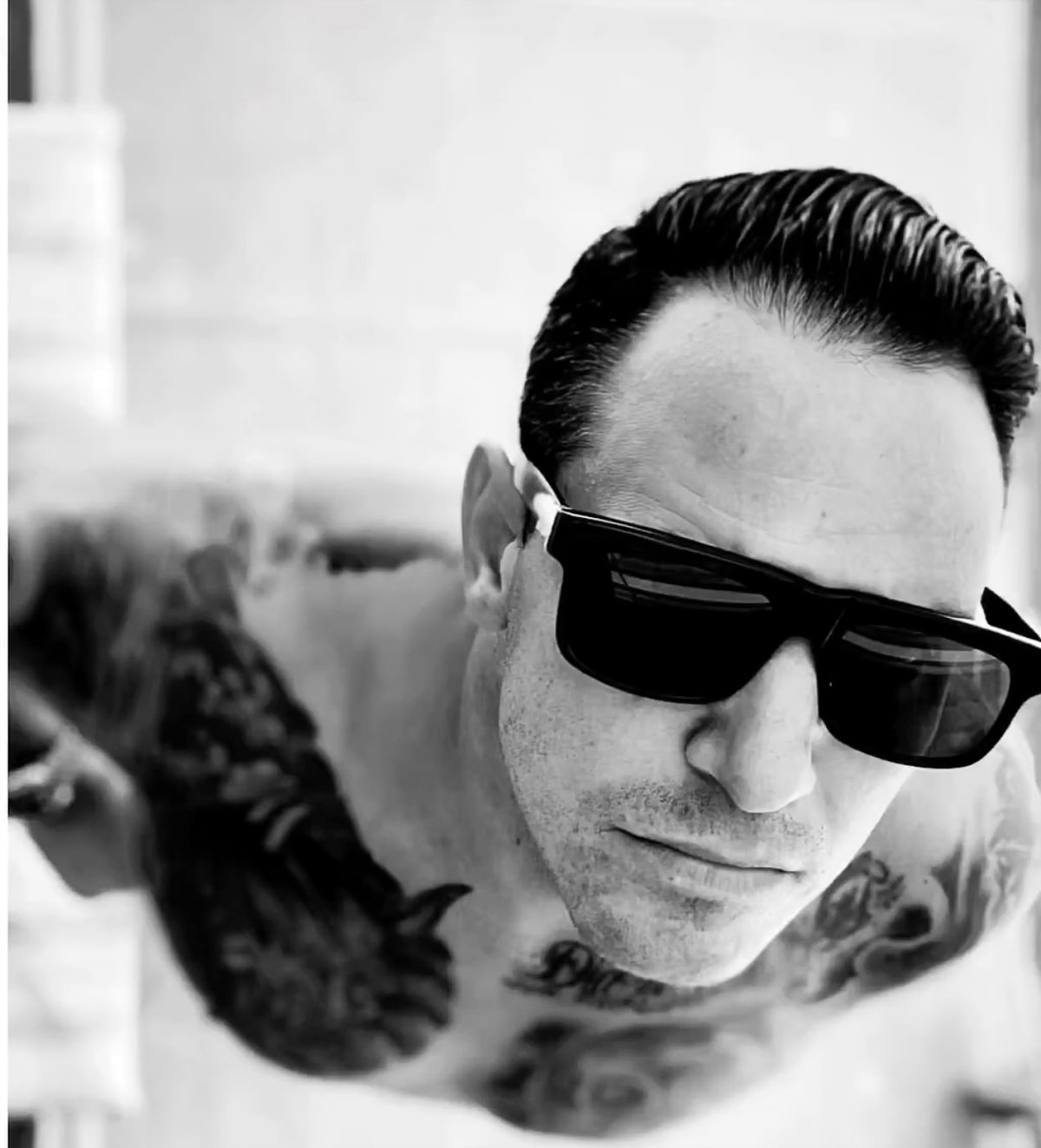 Michael Jannicelli wearing dark sunglasses in the approved Option 2 portrait